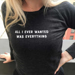 Blonde woman wearing All I every wanted was everything sweatshirt