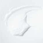 Advanced Lauric Acid Cleanser smeared on white background