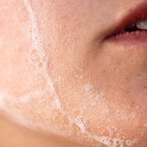 
                  
                    Load image into Gallery viewer, Foaming advanced revitalizing cleanser on chin
                  
                