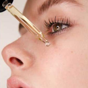 
                  
                    Load image into Gallery viewer, Woman applying Vitamin C Serum under eye
                  
                