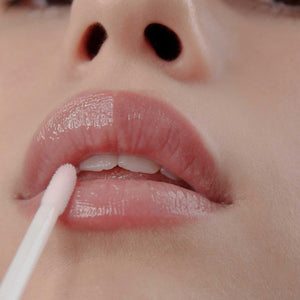 
                  
                    Load image into Gallery viewer, Close up of Woman applying Lip Plum
                  
                
