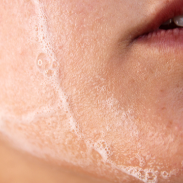 
                  
                    Load image into Gallery viewer, Close up of foaming cleanser on chin
                  
                